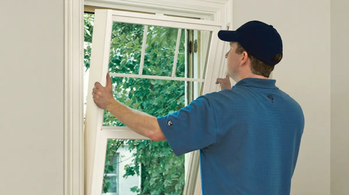Professional contractors performing a residential window insulation and replacement service in Salt Lake City, UT
